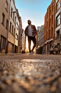 Low angle view of man standing at street