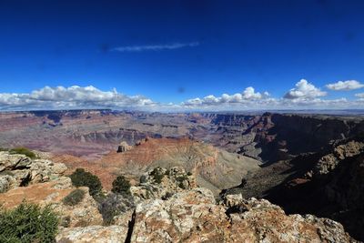 Scenic view of rocky mountains against blue sky at grand canyon national park