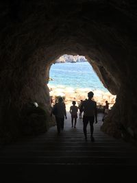 Silhouette of woman in tunnel