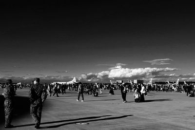 Crowd at iruma air base against sky on sunny day