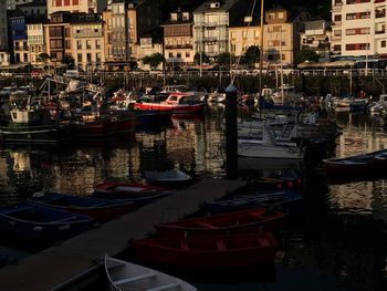 Boats moored at harbor