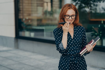 Young woman using mobile phone