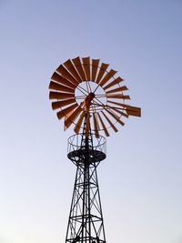 Low angle view of traditional windmill against clear sky