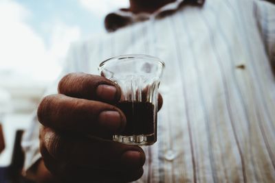 Close-up of hand holding drink