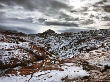 Scenic view of snowcapped mountains against sky