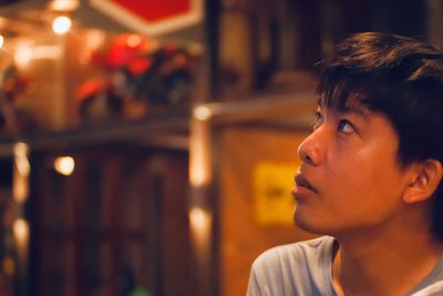 Portrait of boy looking away outdoors