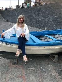 Portrait of smiling young woman standing outdoors