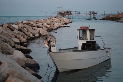 Fishing boats moored in sea