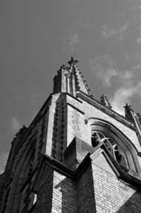 Low angle view of bell tower against sky