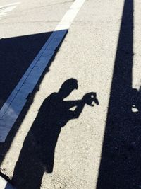 High angle view of shadow on road