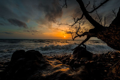 Scenic view of sea against sky during sunset