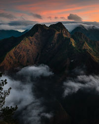 Scenic view of mountains against sky at sunset