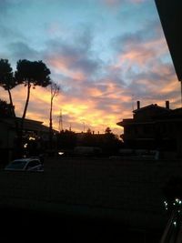 Silhouette of built structure against sunset sky