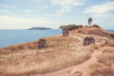 Scenic view of sea against cloudy sky