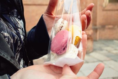 Midsection of woman holding ice cream