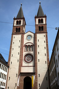 Low angle view of clock tower against sky