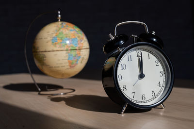 Close-up of clock on table