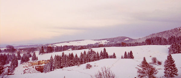 Scenic view of snowcapped mountains against sky during winter