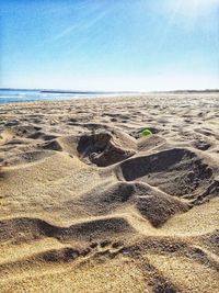 Scenic view of beach against clear sky