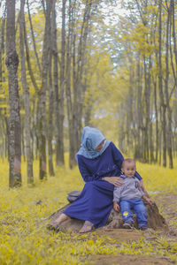 Portrait of mother and child playing in the park