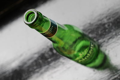 High angle view of beer bottle on table