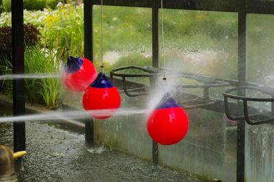 Blurred motion of person seen through wet window