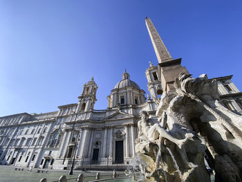 Low angle view of building against blue sky