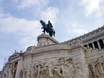 Low angle view of statue against sky