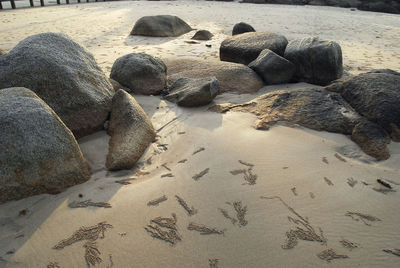 Pebbles on sand at beach