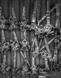 Full frame shot of shoes hanging on wood