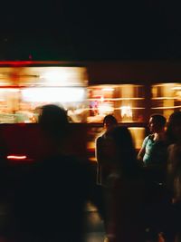 Blurred motion of people at night