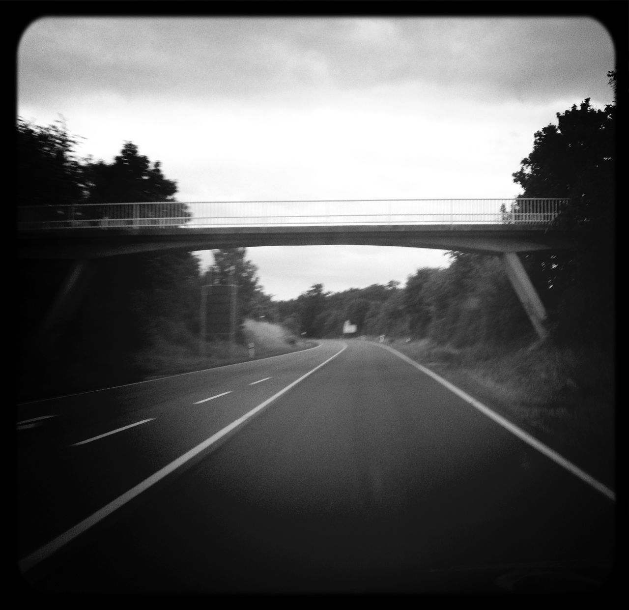 transfer print, transportation, sky, auto post production filter, the way forward, tree, road, diminishing perspective, vanishing point, cloud - sky, connection, road marking, nature, tranquility, railing, no people, outdoors, country road, tranquil scene, bridge - man made structure