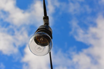 Low angle view of street light against sky