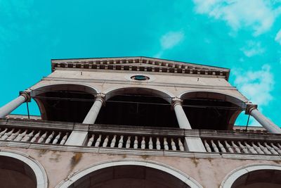 Low angle view of historical building against blue sky