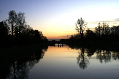 Reflection of trees in calm lake