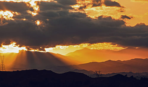 Scenic view of dramatic sky during sunset