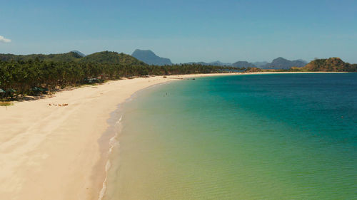 Wide sand beach nacpan beach, aerial view. el nido, palawan, philippine islands. 