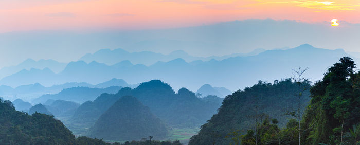 Scenic view of mountains against sky during sunset