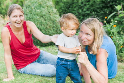 Family on grassy field at park