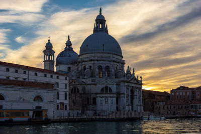 View of buildings against sky at sunset