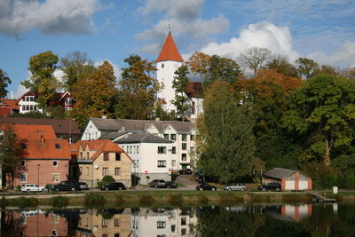 Buildings in town against sky