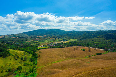 Scenic view of agricultural field against sky