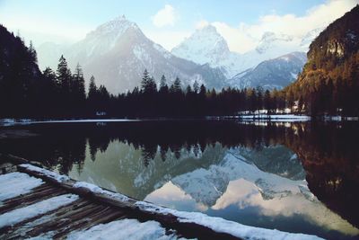 Scenic view of lake and mountains against sky