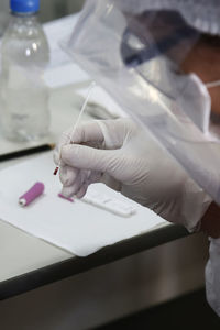 Close-up of human hand on table