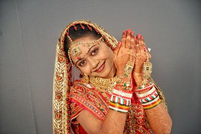 Close-up portrait of smiling young bride at home 