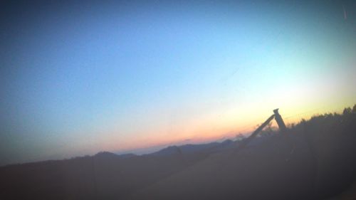 Silhouette of mountain against clear sky