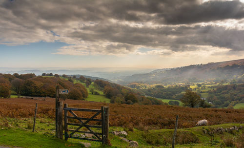 Scenic view of landscape against cloudy sky