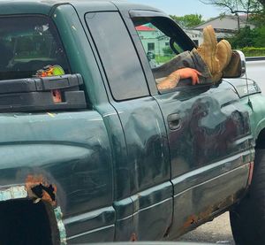 Reflection of car on side-view mirror