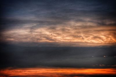 Scenic view of dramatic sky during sunset