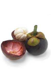Close-up of fruits against white background